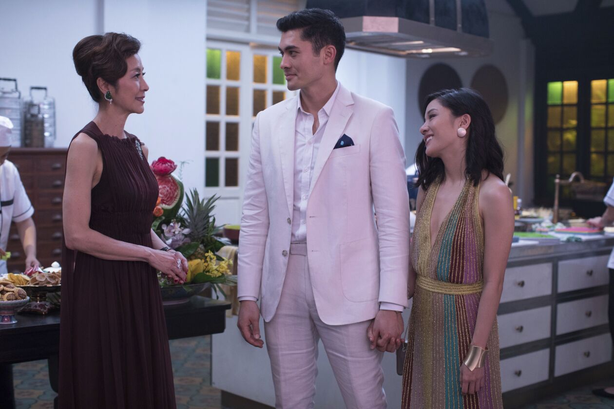 This image released by Warner Bros. Entertainment shows Michelle Yeoh, from left, Henry Golding and Constance Wu in a scene from the film “Crazy Rich Asians.” | Sanja Bucko/Warner Bros. Entertainment via AP